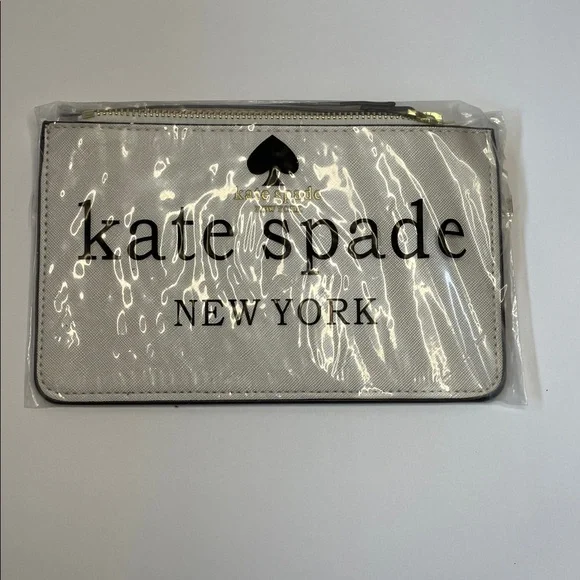 NWT Kate Spade cream saffiano wristlet with gold logo.  8x5” - Picture 7 of 7